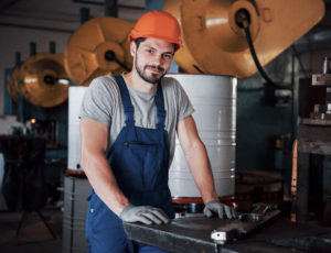 Portrait young worker hard hat large metalworking plant - Gépkezelő operátor